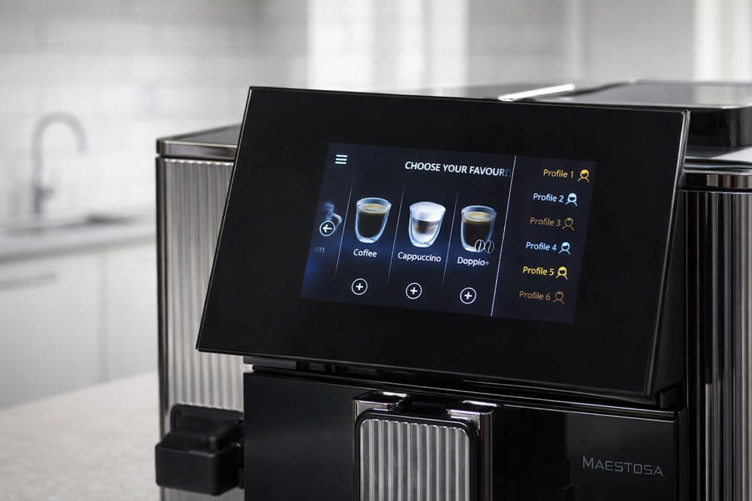 Close-up of the De'Longhi Maestosa coffee machine's 5-inch color touch screen tilted upward. The display shows coffee icons and user profiles against a sleek black glass background with stainless steel ribbing on the side.